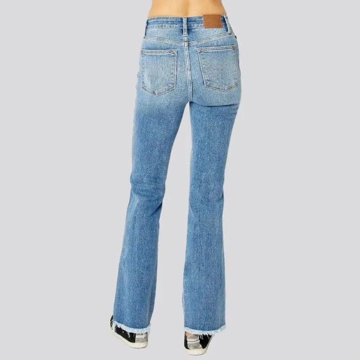 Whiskered women's distressed jeans
