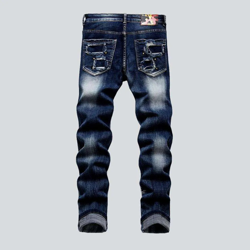 Rivet embellished patched men's jeans