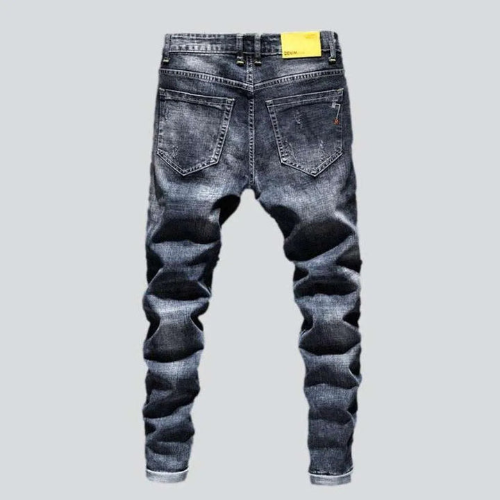 Washed men's ripped jeans