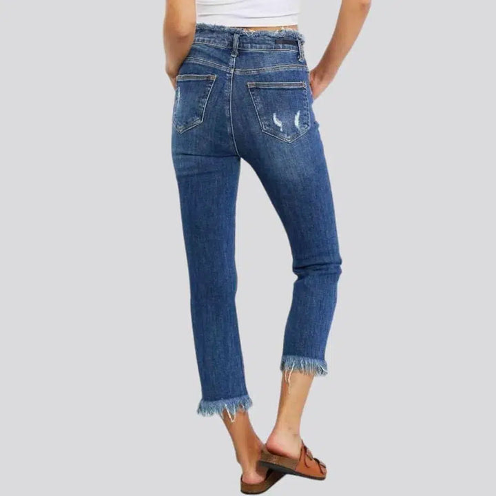 Distressed medium-wash jeans
 for women