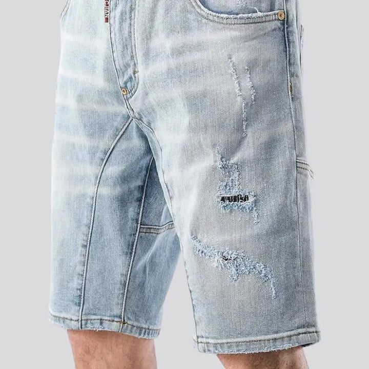 Sanded distressed denim shorts