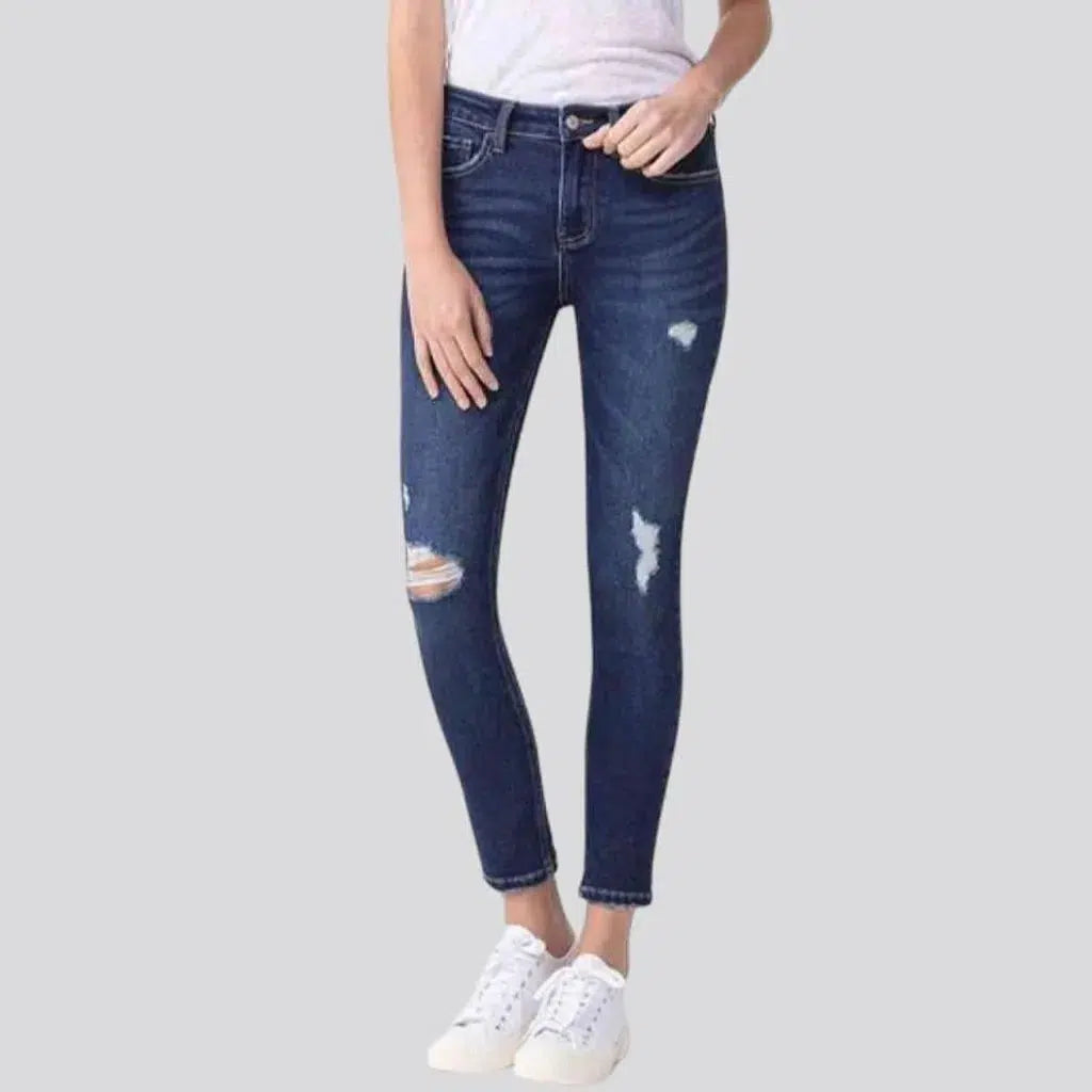 Ankle-length whiskered jeans