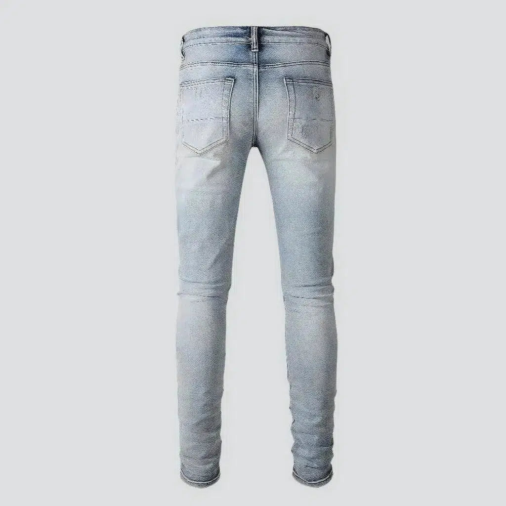 Light-wash distressed jeans