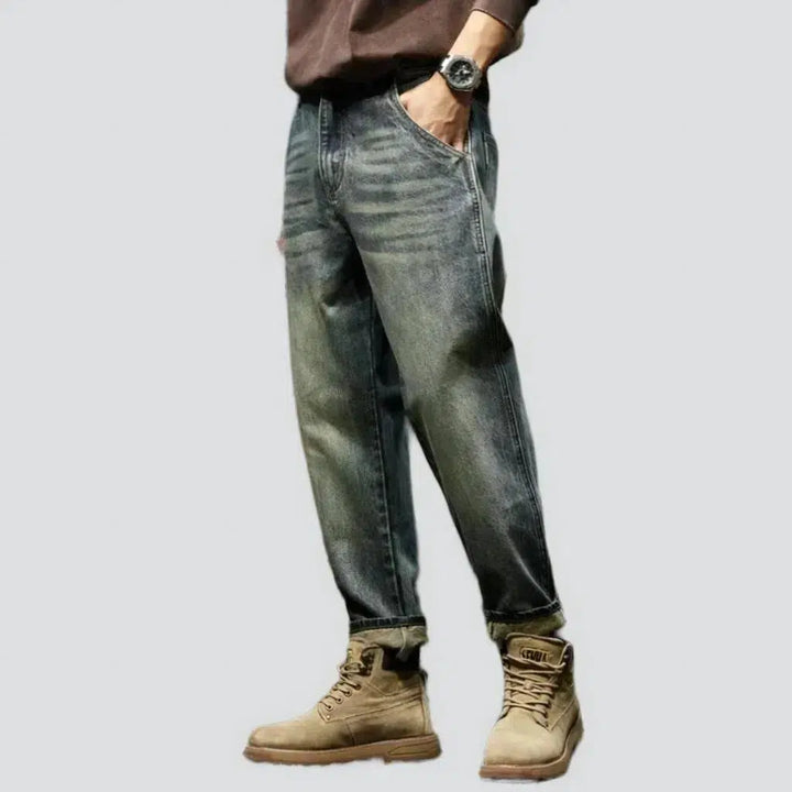 Sanded medium-wash jeans
 for men