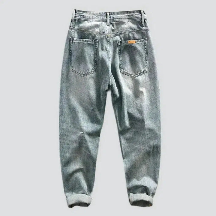 Whiskered men's light-wash jeans