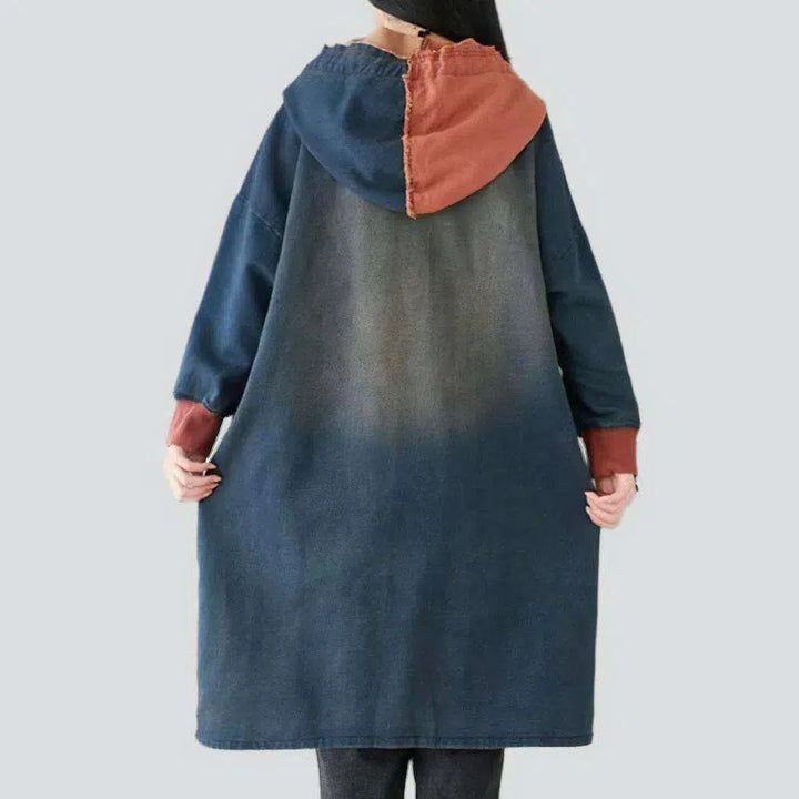 Long medium-wash denim coat
