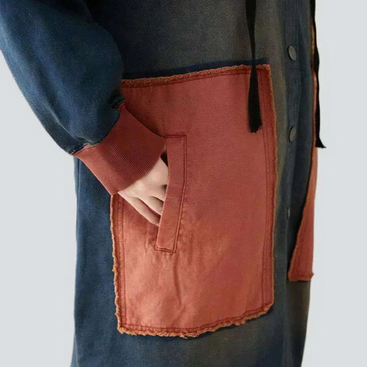 Long medium-wash denim coat