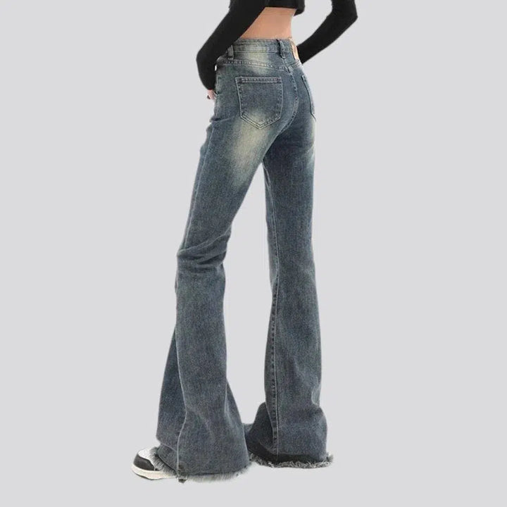Medium wash whiskered jeans
 for women