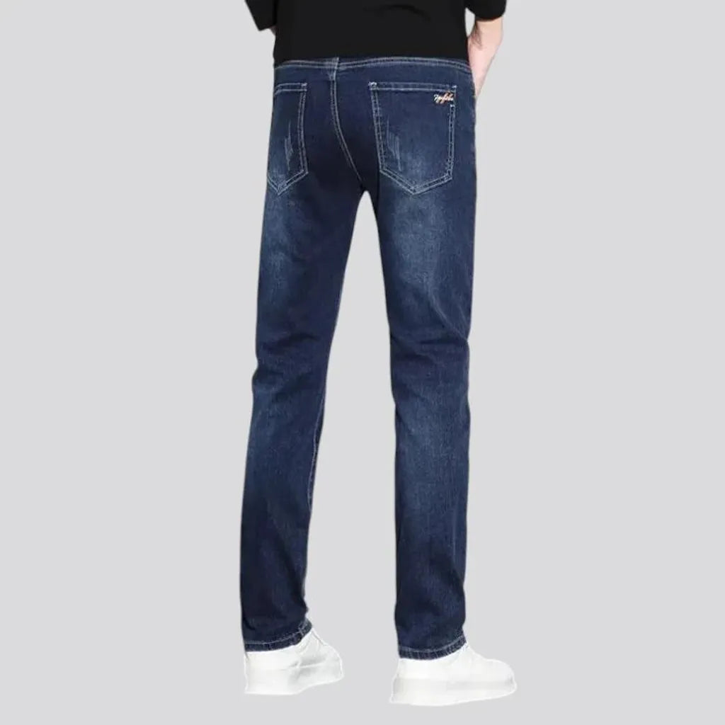 Dark slim-fitting casual men's jeans