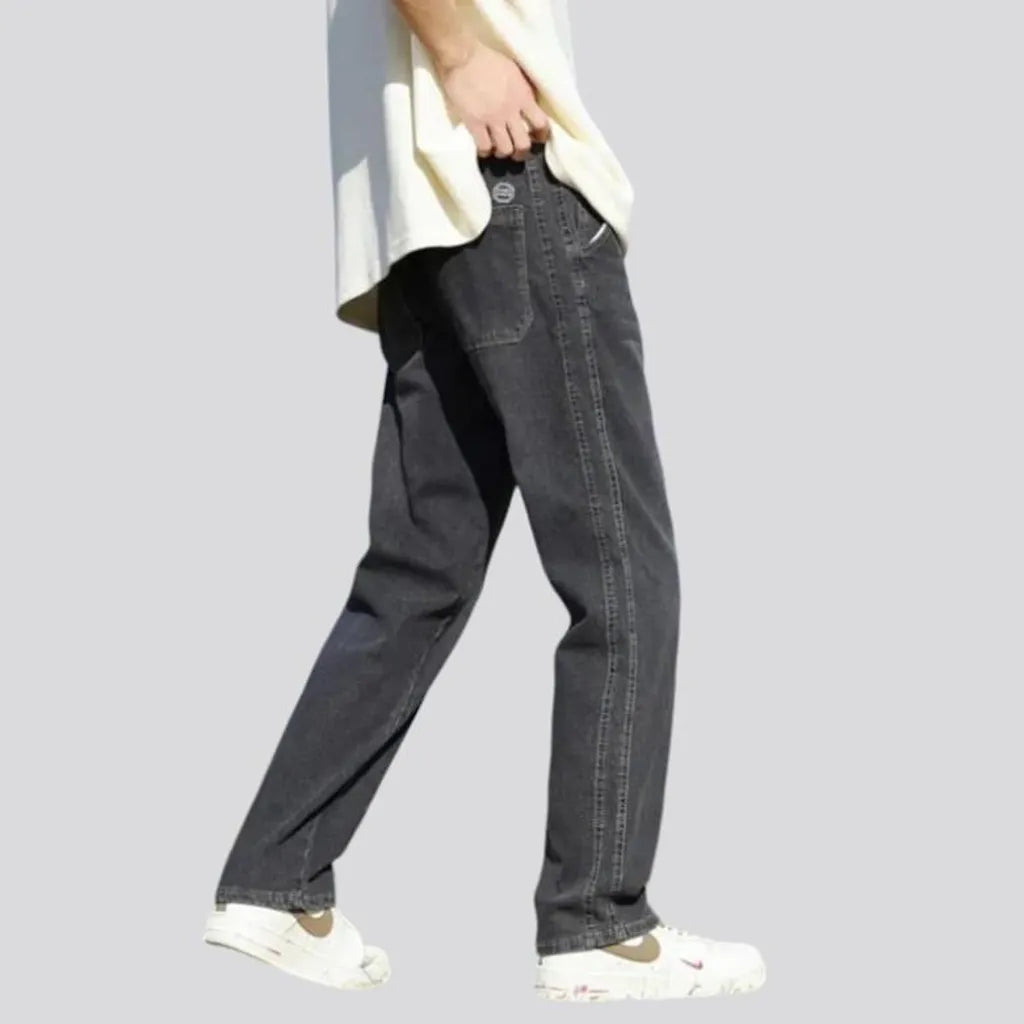 Stonewashed men's floor-length jeans