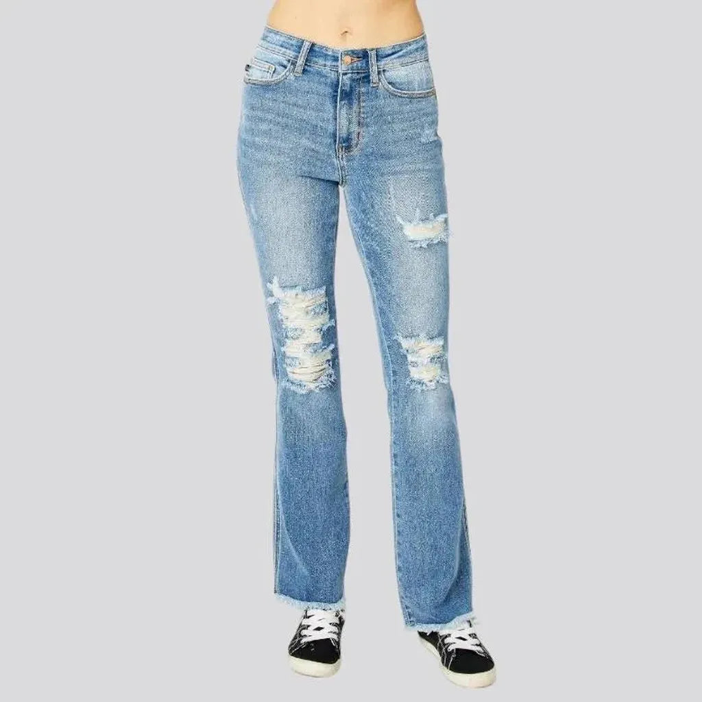 Whiskered women's distressed jeans