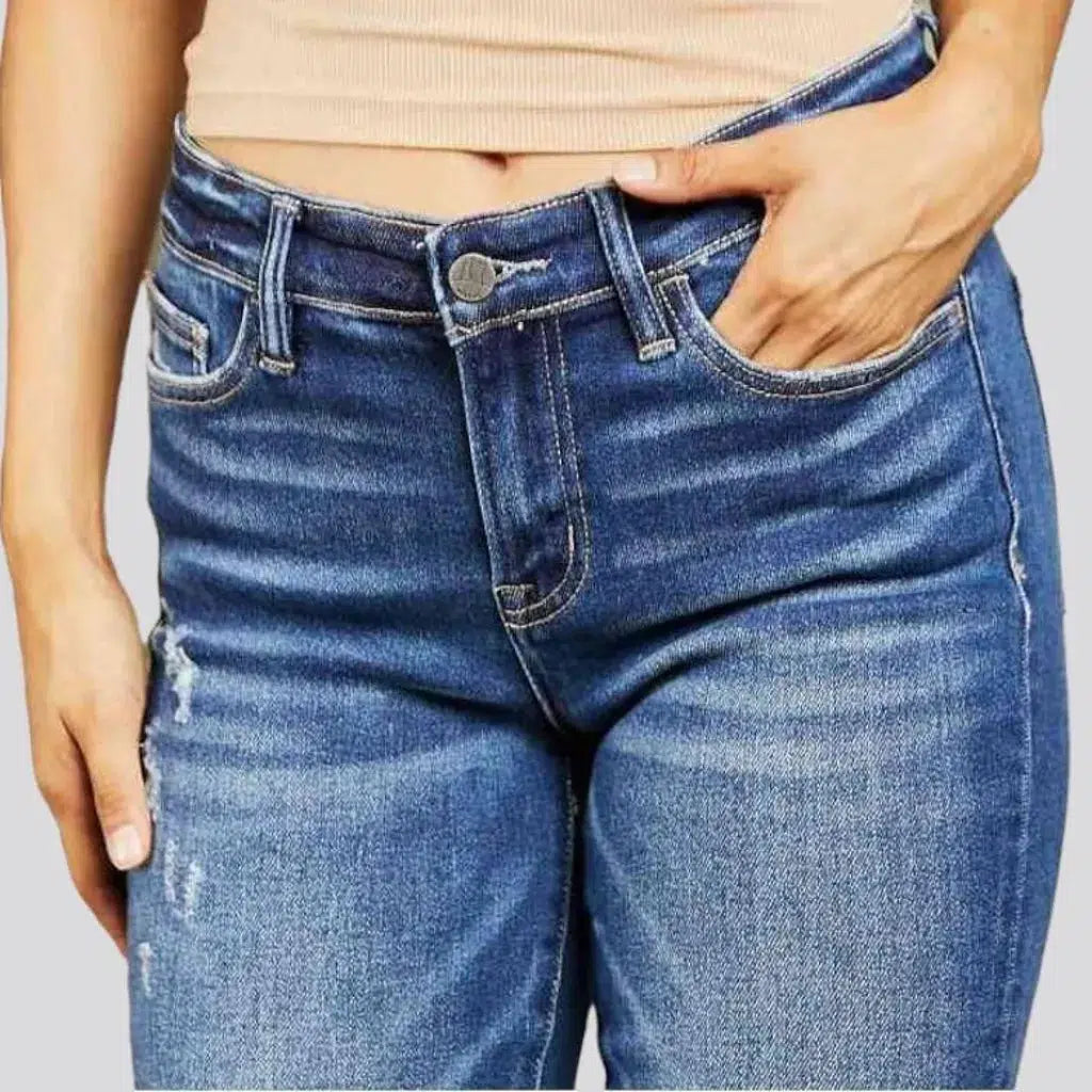 Medium-wash women's mid-waist jeans