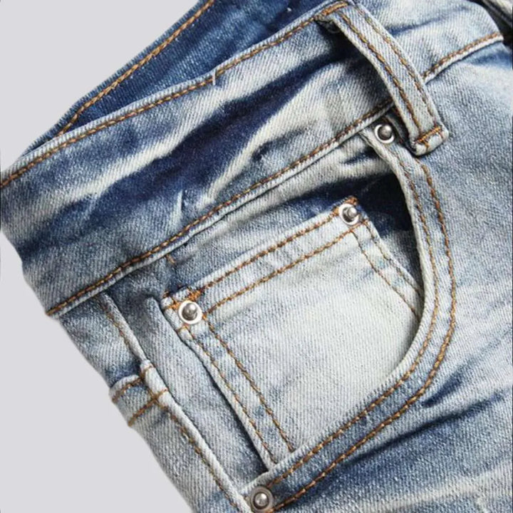 Light wash color men's patch jeans