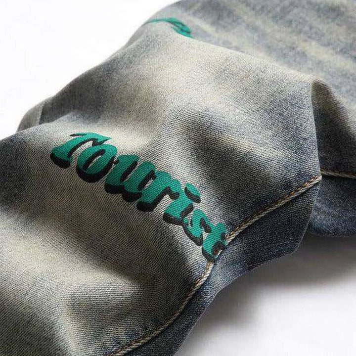 Vintage jeans with green inscriptions