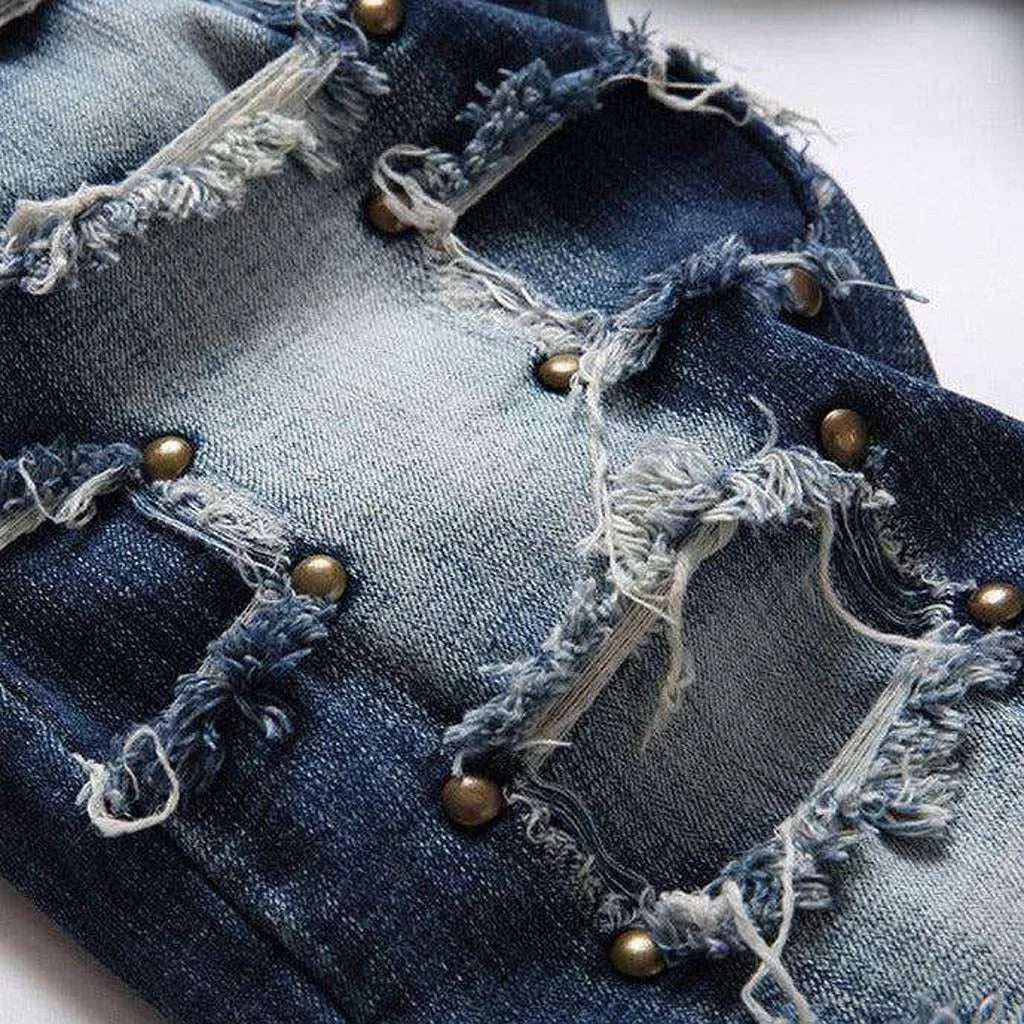 Rivet embellished patched men's jeans