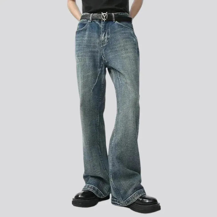 Medium-wash sanded jeans
 for men