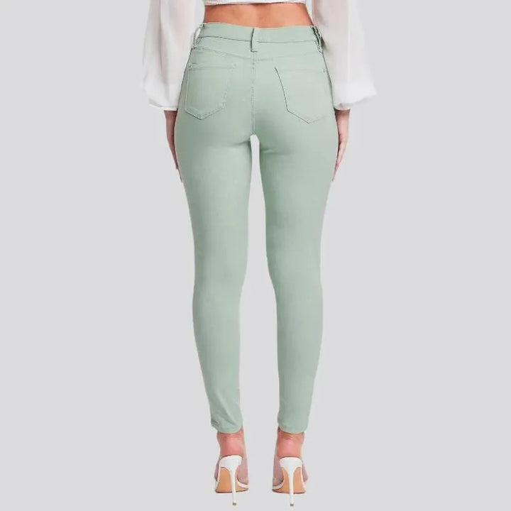 High-waist women's pale-green jeans