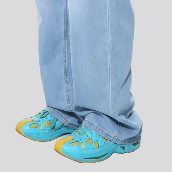 Floor-length men's light-wash jeans