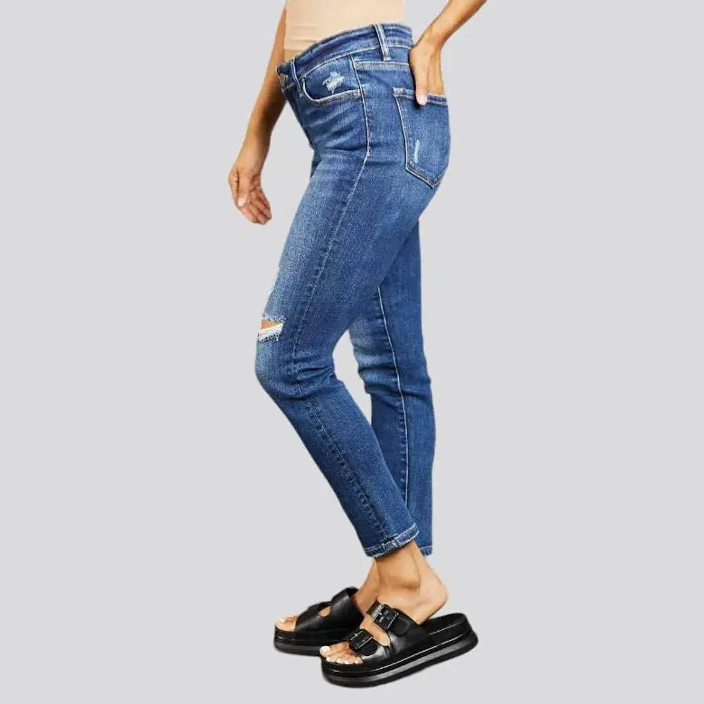 Medium-wash women's mid-waist jeans