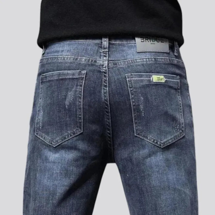 Elastic dark padded jeans for men