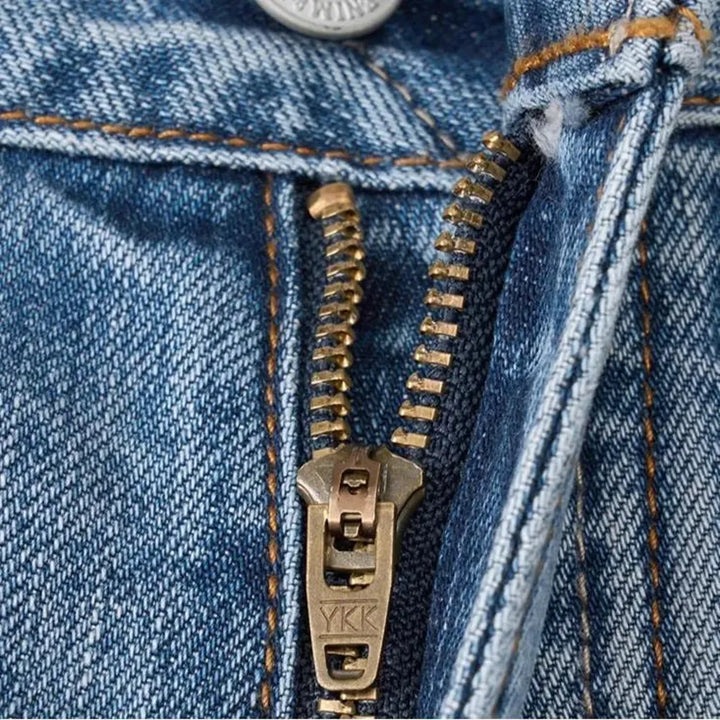 Distressed men's self-edge jeans
