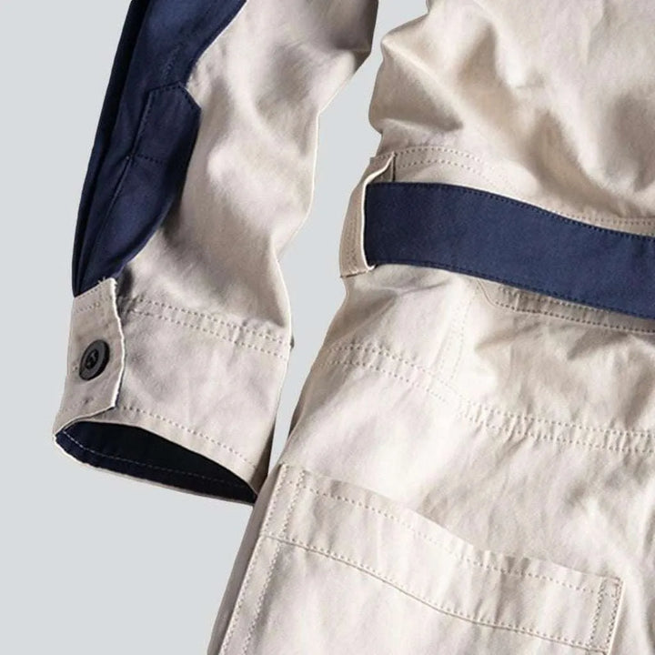 White overall with blue bands