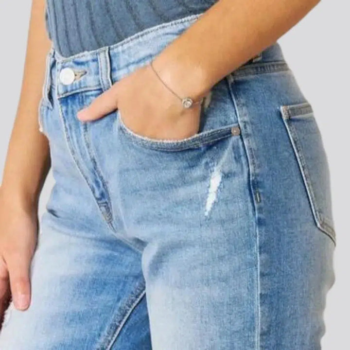 Sanded women's distressed jeans