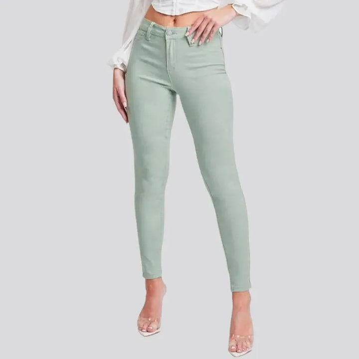 High-waist women's pale-green jeans