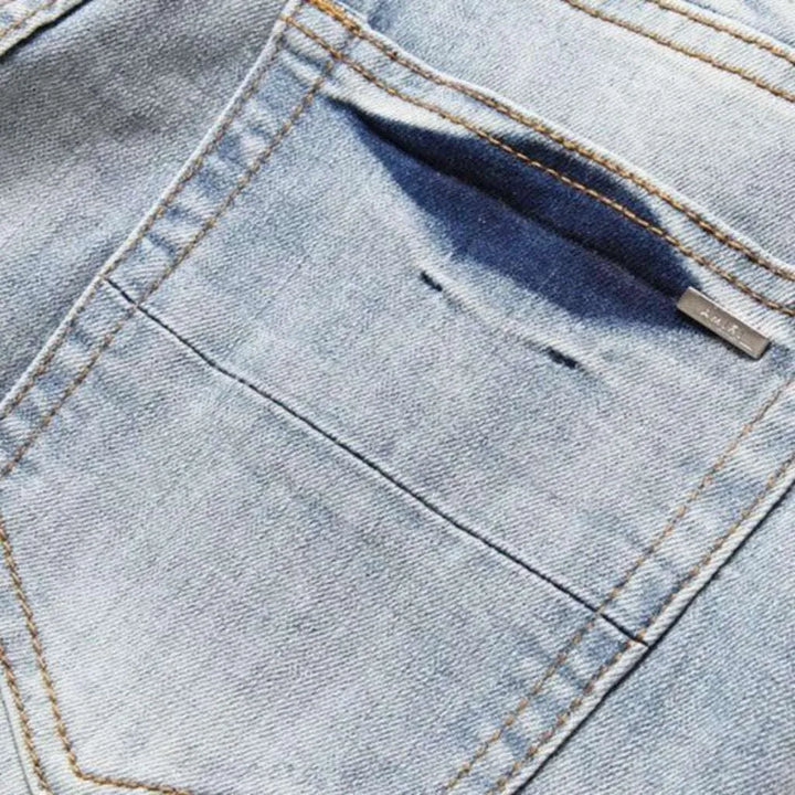 Light wash color men's patch jeans