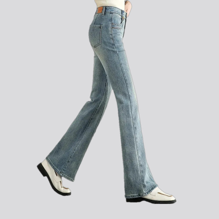 Fashionable mid-waist creased women's jeans