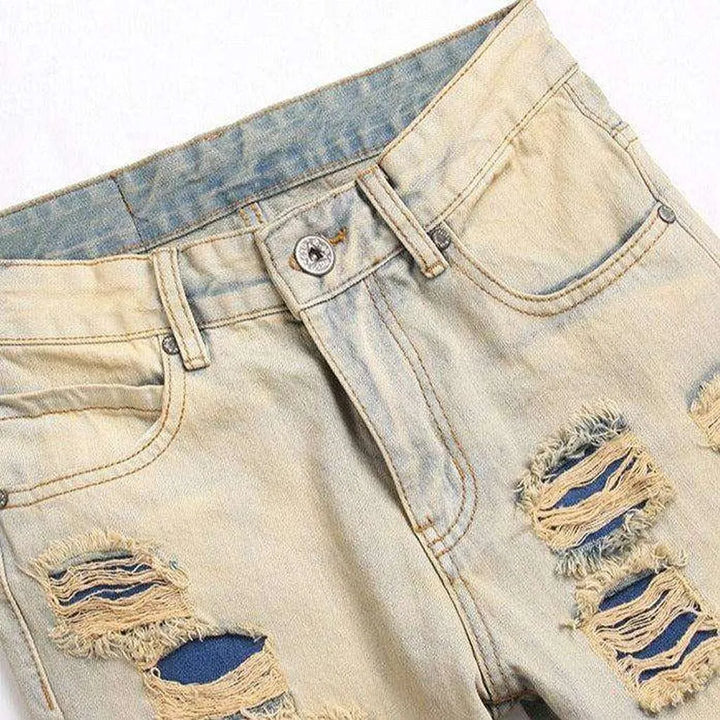 Distressed men's jeans with zippers