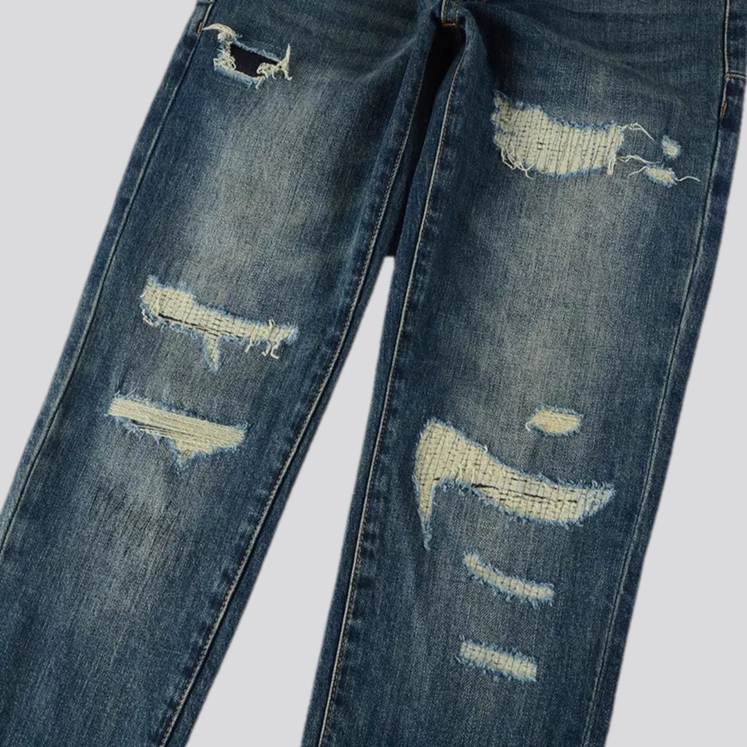 Distressed elastic men's jeans