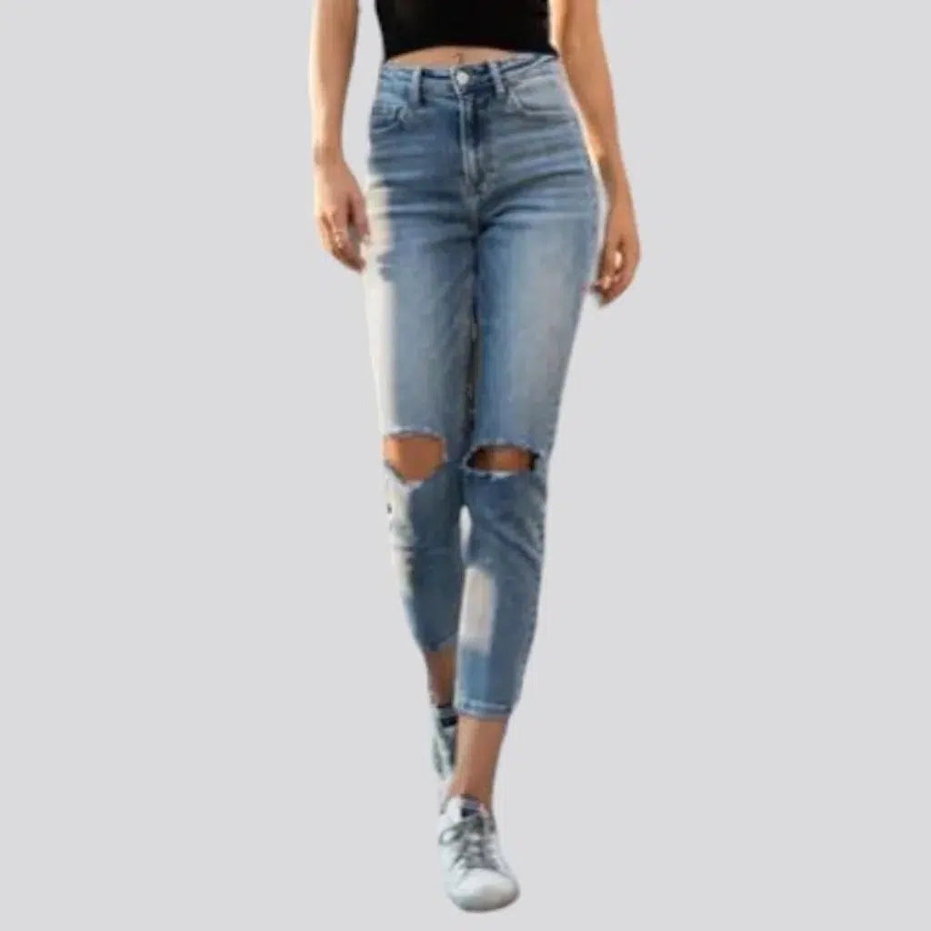 Skinny women's ripped-kneed jeans