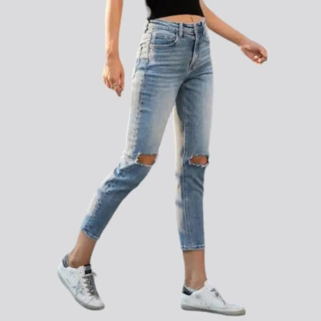 Skinny women's ripped-kneed jeans