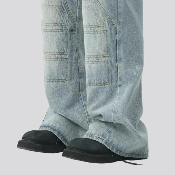 Light-wash men's floor-length jeans