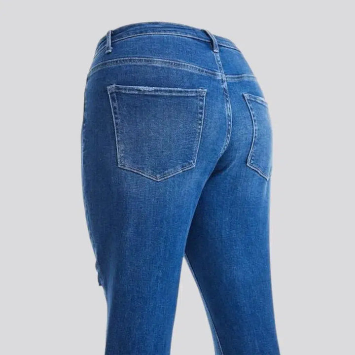 High-waist whiskered jeans