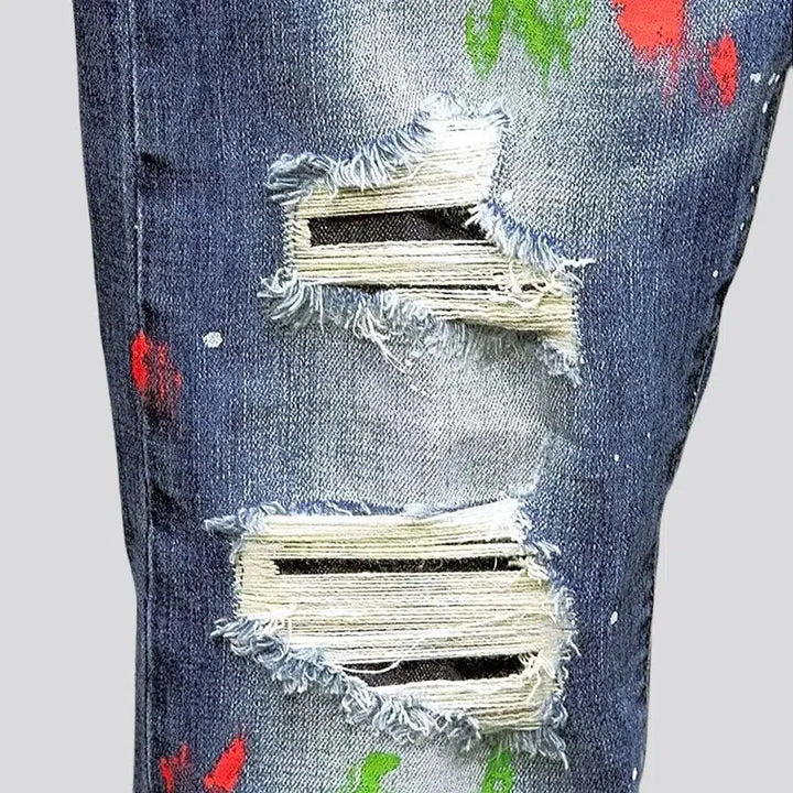 Paint-splattered medium wash jeans