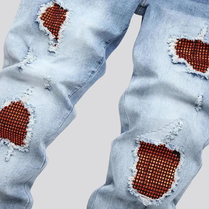 Sanded men's red-crystal-patch jeans