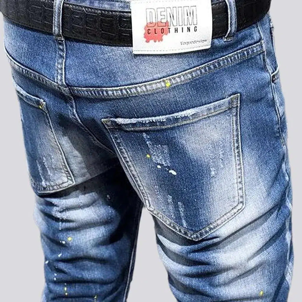 Paint-splattered mid-waist jeans