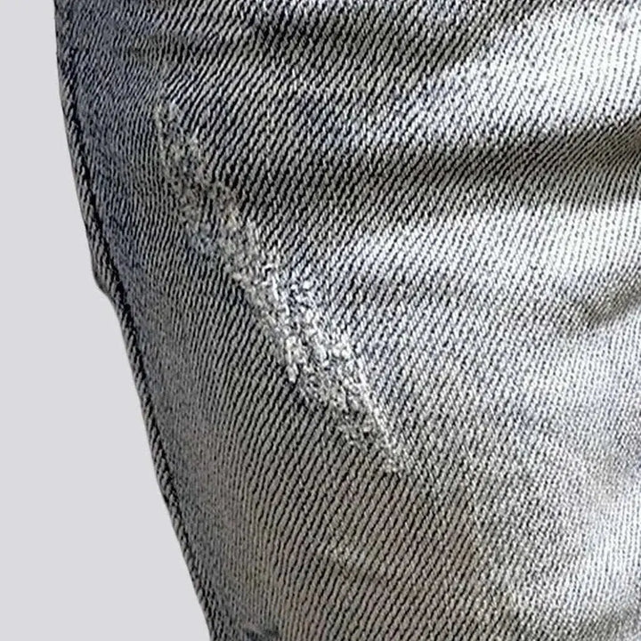 Slightly torn men's fabric jeans