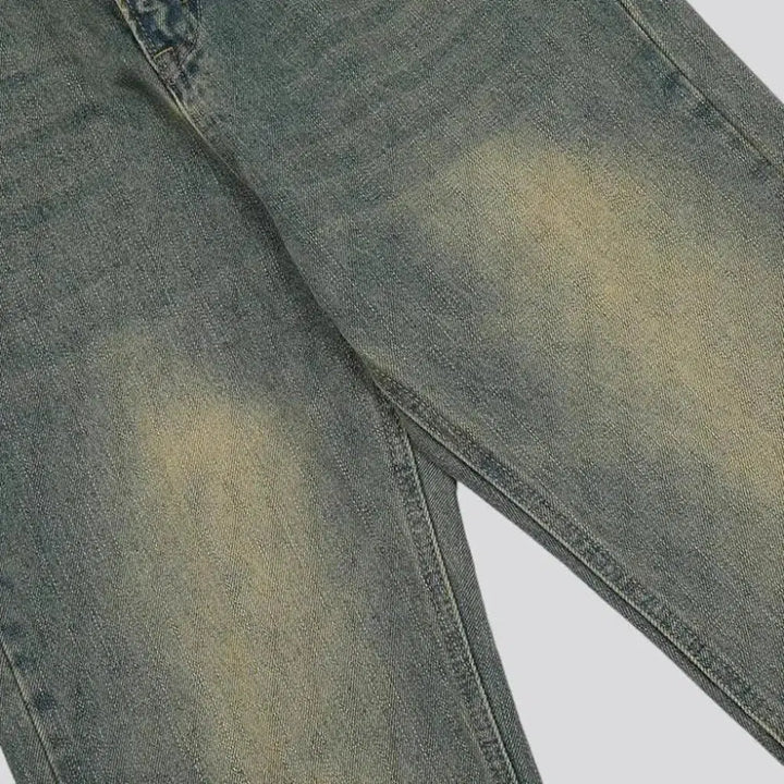 Medium-wash whiskered jeans
 for men