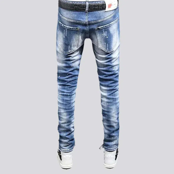 Paint-splattered mid-waist jeans