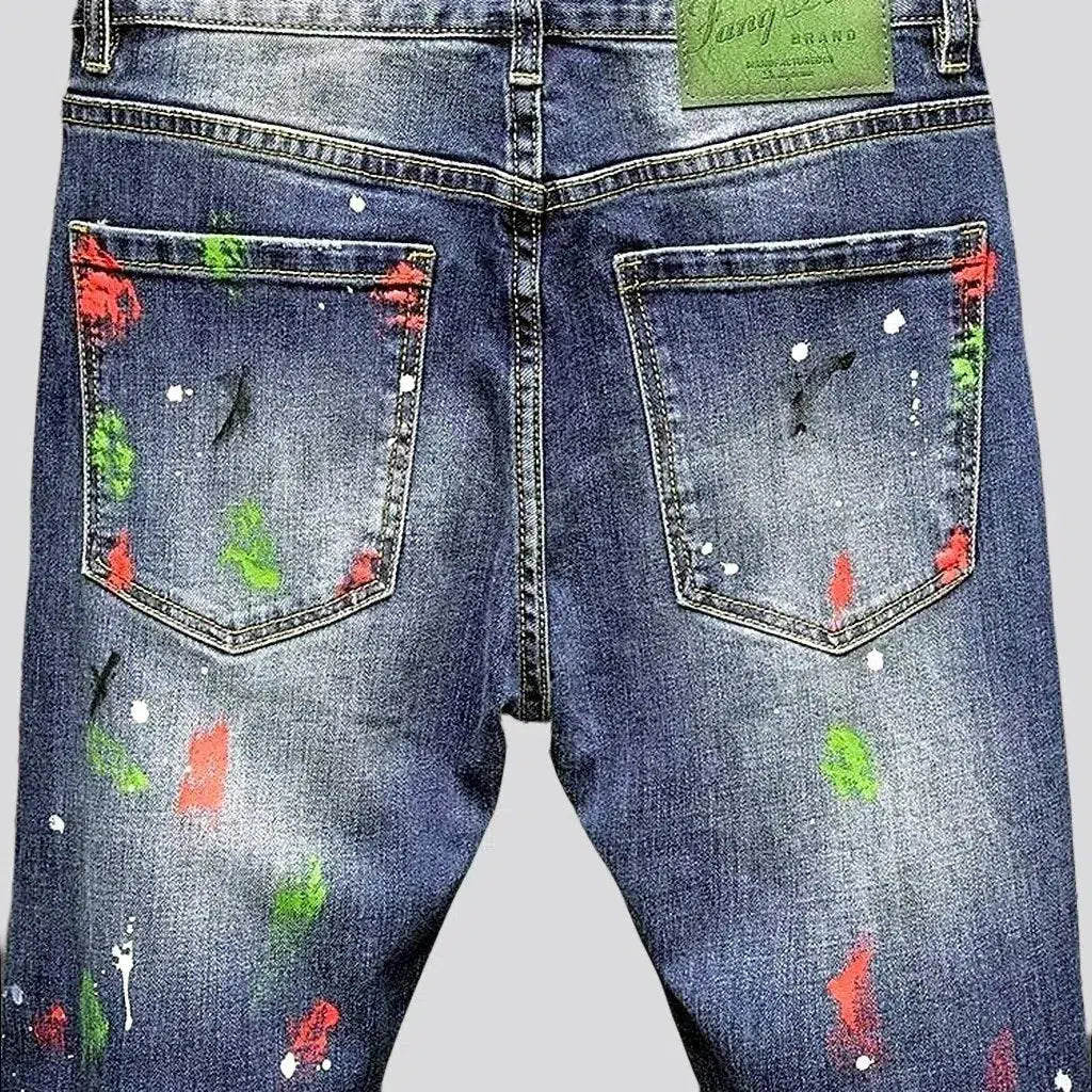 Paint-splattered medium wash jeans