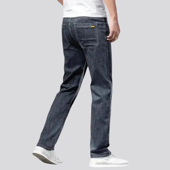 Whiskered men's mid-waist jeans