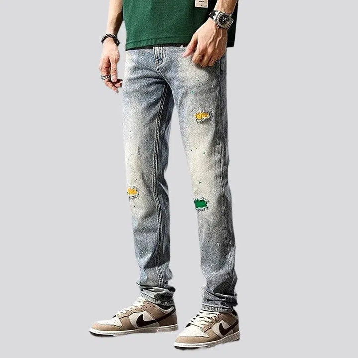 Grunge men's distressed jeans
