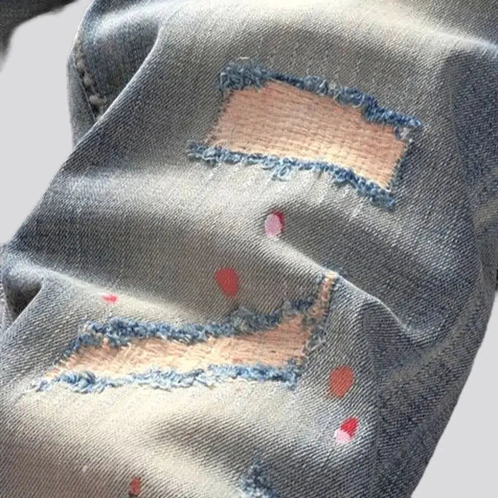 Paint-splattered men's skinny jeans