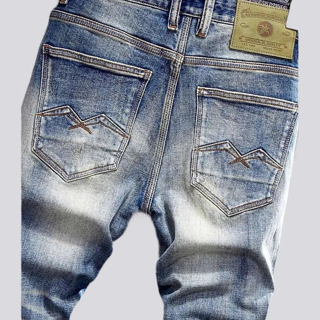 Slightly torn men's vintage jeans