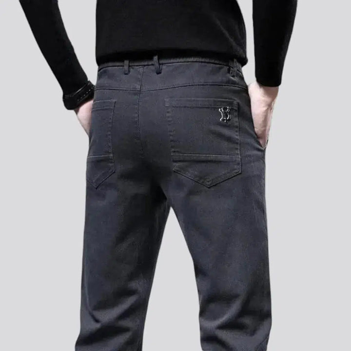 Dark men's mid-waist jeans