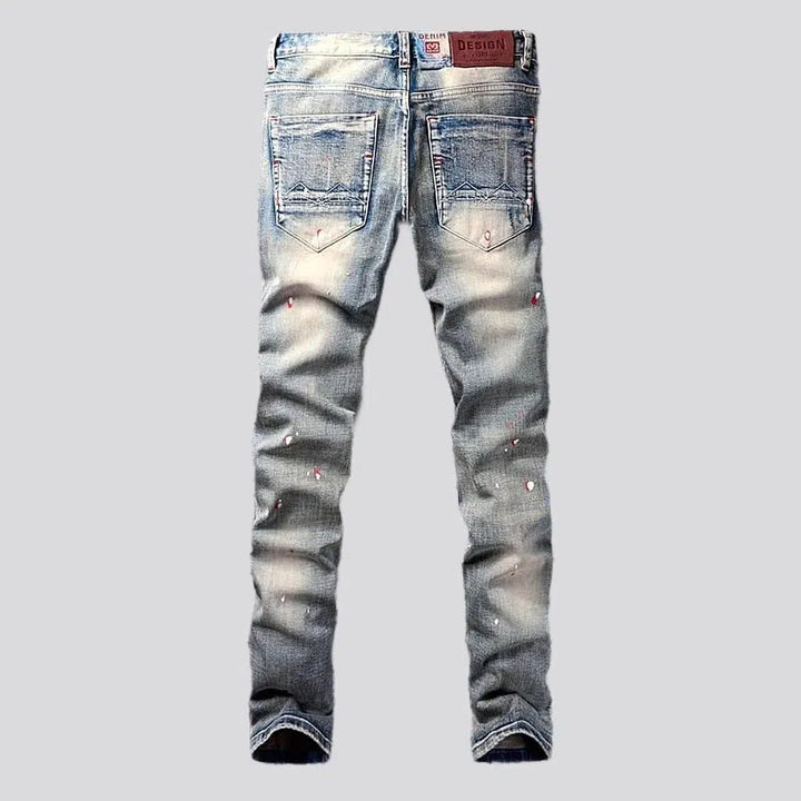 Paint-splattered men's skinny jeans