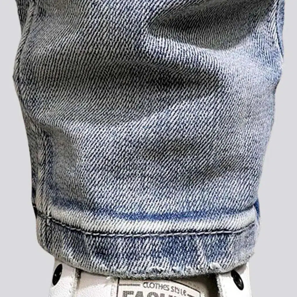 Slightly torn men's fabric jeans